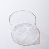 Clear glass pitcher on a white background