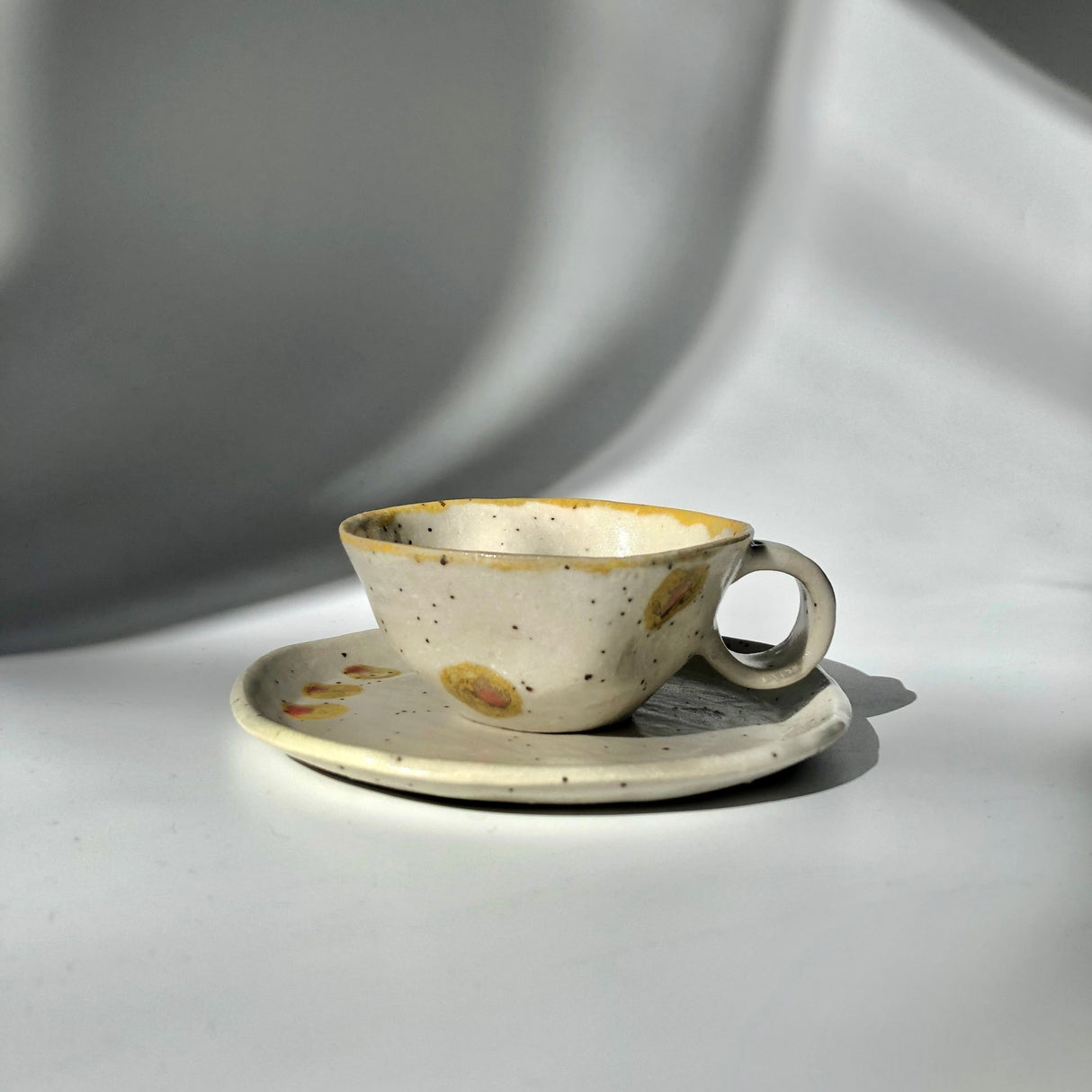 Hiroshi Hirai: Heart Shaped Cup & Saucer Set, Yellow Accents - natsumiya.live