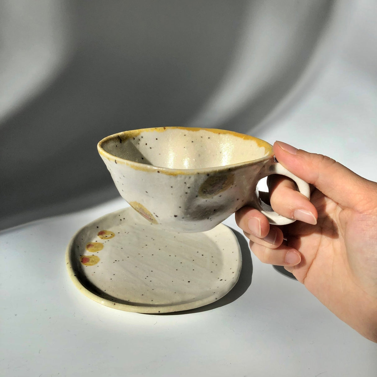 Hiroshi Hirai: Heart Shaped Cup & Saucer Set, Yellow Accents - natsumiya.live